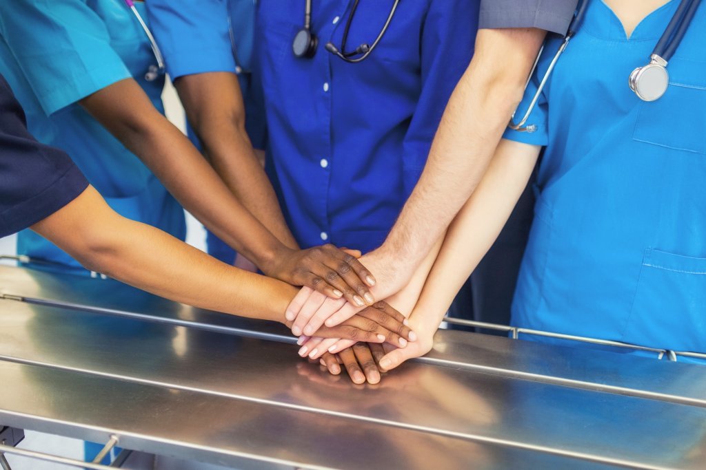 Nurses putting their hands together