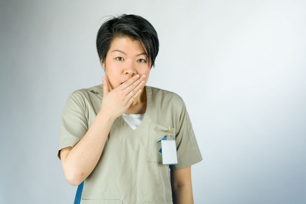 A nurse with a surprised expression